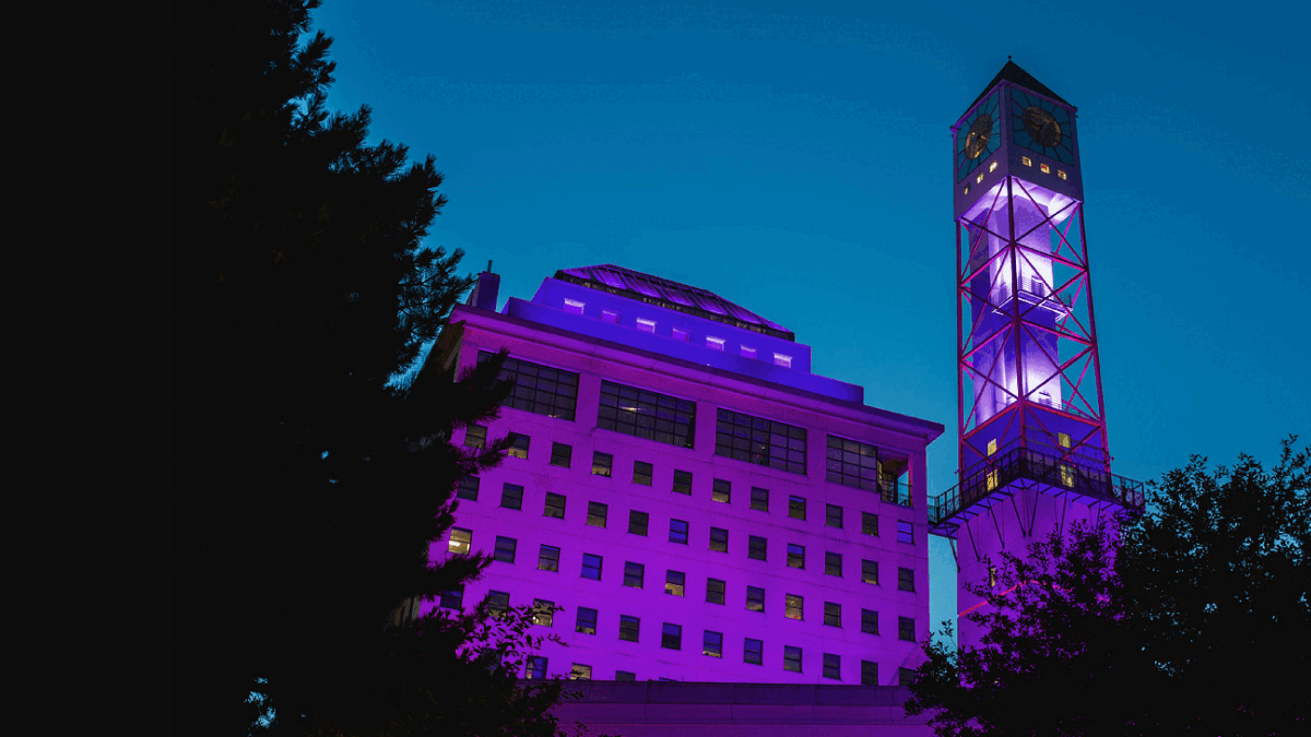 The Civic Centre clock tower lit purple and blue.